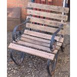 A slatted and wrought iron garden armchair, 60cmW