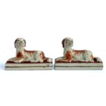 Two Staffordshire figurines of recumbent Spaniels, 14.5cmL