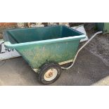 A large plastic garden wheelbarrow with two tyres, 77cmW