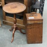 An oak coal scuttle, with brass and turned wood handle, 26cmW; together with a small wine table,