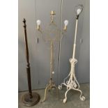 A white painted wrought metal standard lamp; together with a wrought metal three arm standard lamp