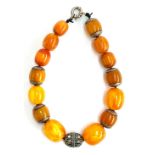 A 20th century bakelite and white metal bead necklace, total weight approx. 200g, the largest bead