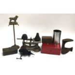 A mixed lot of vintage metal items to include kitchen scales, strongbox, shoe slob, slicer, etc