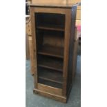 A stained pine cabinet with textured glass door, 54x35x132cm