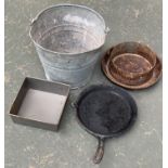 A galvanised bucket, a square loaf tin, cast iron skillet, and one other item (4)