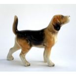 A ceramic beagle, stamped to base, 8.5cmH