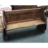 A 19th century pine pew, each end with folding leaf, 135cmW