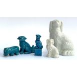 A Chinese blue glazed foo dog standing on a plinth, 11cmH together with 2 other blue glazed