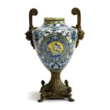 A decorative urn with gilt metal twin handles and base, 40cmH
