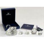 A Swarovski swan, 5cmH, together with 2 smaller Swarovski swans, 2cmH, and 2 other similar,