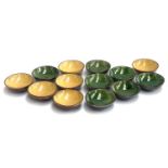 A set of 13 green and mustard glaze studio pottery bowls, 13cmD