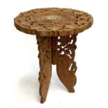 A small folding Indian carved and inlaid occasional table, 34cmH