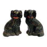 A pair of black glaze Staffordshire dogs, 24cmH