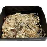 A mixed lot of mainly faux pearl necklaces and bracelets