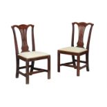 A pair of George III oak side chairs, circa 1780, each with a drop in seat 96cm high(2)