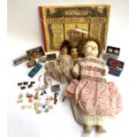 A mixed lot of toys to include a 1950s hard plastic Pedigree doll, bisque porcelain doll (af), small