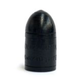 A trench art carved bog oak bullet, inscribed 'A Black Maria, It's A Long Way To Tipperary', 5.5cmH