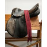 A Lovatt & Ricketts saddle, 17"; together with a Cottage Craft girth, 39"
