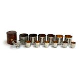 A cased set of German stirrup cups comprising 6 cups and 6 shot glasses, each with gilt interior