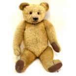A large vintage Chad Valley Hygienic Toys teddy bear, with brown and black eyes and pronounced