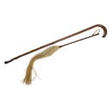 A colonial horse hair fly swat, together with a walking stick