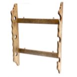 An oak gun rack, for three guns, 68cm wide