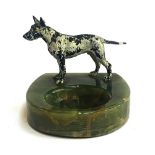 An onyx ashtray mounted with a cold painted bronze of a dog, 8.5cm high