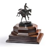 A modern bronze group of racehorses, one with jockey up, on an associated black marble base with