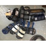 A Woofware full size full set of boots, tail guard, various other sets of Woofware boots, and a full