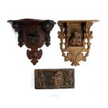 Two carved wall brackets, one with leopard's head, the other with anthropomorphic fox, each