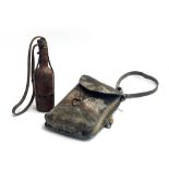 An early 20th century leather food satcher, together with a glass drinking bottle in leather case