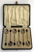 A cased set of six George V silver and guilloche enamel bean terminal coffee spoons, William