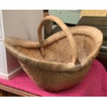 A wicker basket with bamboo carry handle, 55cmW