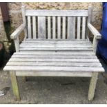 A G W Bro slatted garden table, together with garden bench, the bench 112cmW