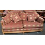 A contemporary Ercol three seater sofa, light oak and upholstered in a large check, approx. 190cmW