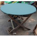 An Alexander Rose folding teak slatted garden table with waterproof cover, 125cmD, 75cmH