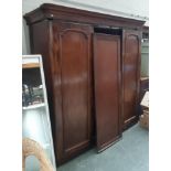 A Victorian mahogany gents three part compactum wardrobe, with hanging rail and right-hand section