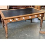 A good Victorian oak and pine desk, leather inset top, with three drawers to each side, with ceramic