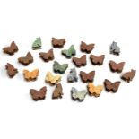 A quantity of wooden pegs in the form of butterflies and cats, decorated with marbled paper