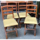 A set of four modern folding chairs