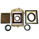 A lot of eight various picture frames, including a pair of 19th century circular ebonised frames,