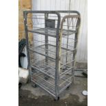 A galvanised metal storage trolley on wheels