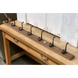 A coat rack of seven hooks, 123cmW