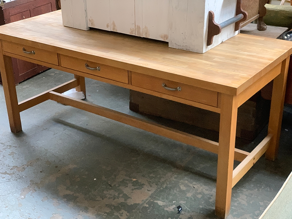 A large beechwood kitchen table, with drawers to each side, square legs and H stretcher,