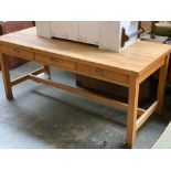 A large beechwood kitchen table, with drawers to each side, square legs and H stretcher,