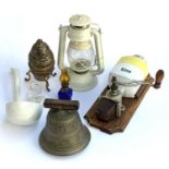 A wall mounted European vintage coffee grinder; brass bell; oil lamp; ceramic ladle etc