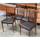 A set of four mid century G Plan style teak and black vinyl dining chairs