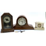 A mahogany cased domed mantel clock, striking on a chime, 45cmW; a further mantel clock; and a