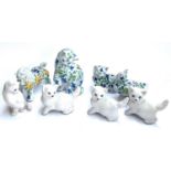 Four glazed ceramic Italian animals with floral pattern, together with four plain ceramic cat