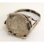 A silver ring set with a 1911 George V maundy threepence, size L